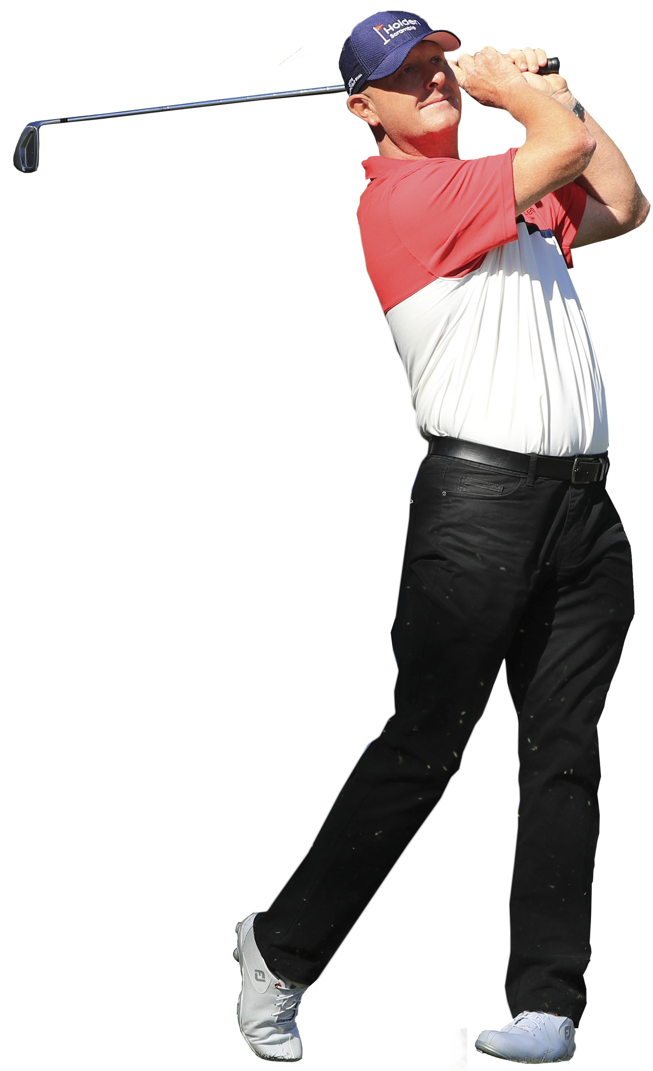 Golfer in red and white shirt swinging a club