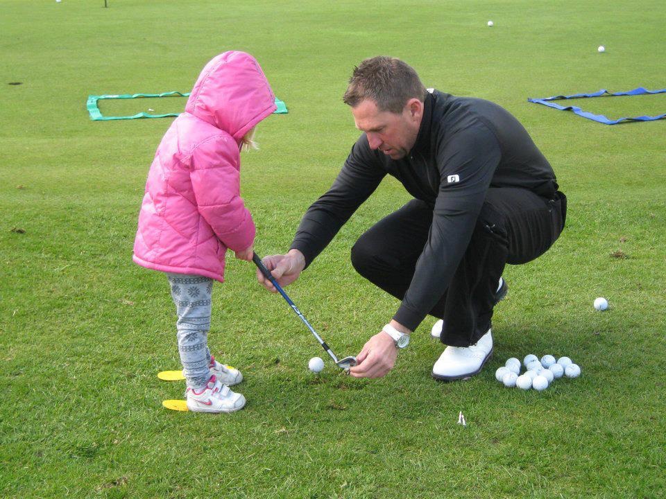 Junior coaching::Paul teaching a young beginner